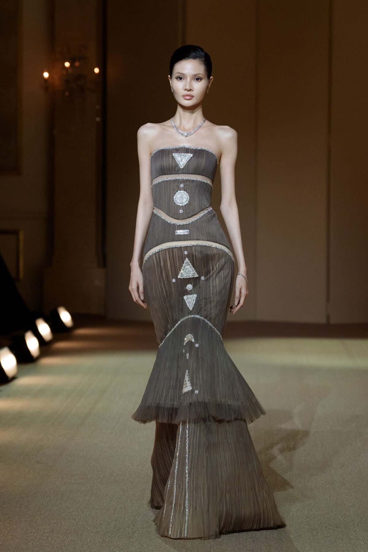 Dusky taupe strapless mermaid gown with cut-outs and silver embellishments