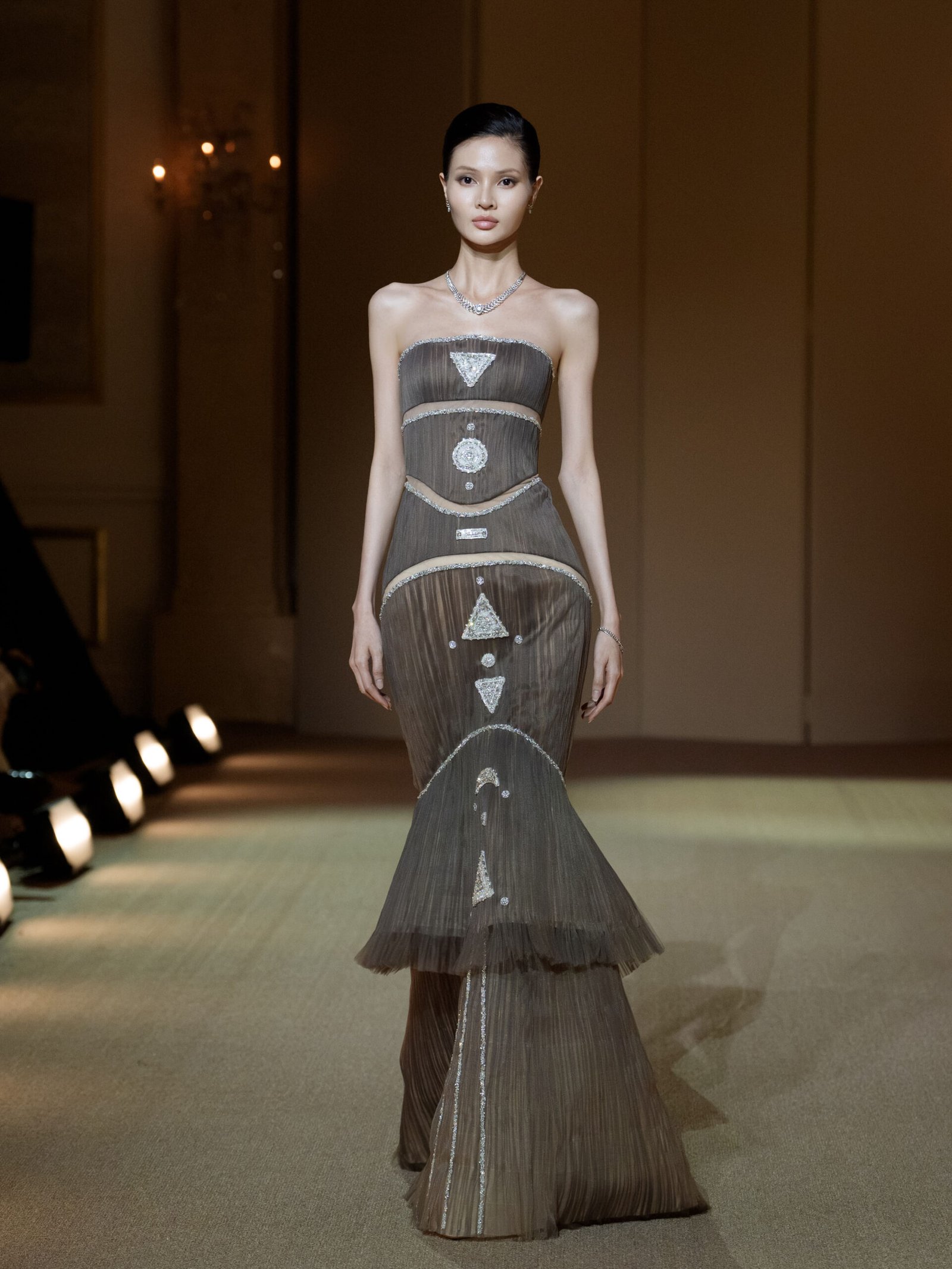 Dusky taupe strapless mermaid gown with cut-outs and silver embellishments