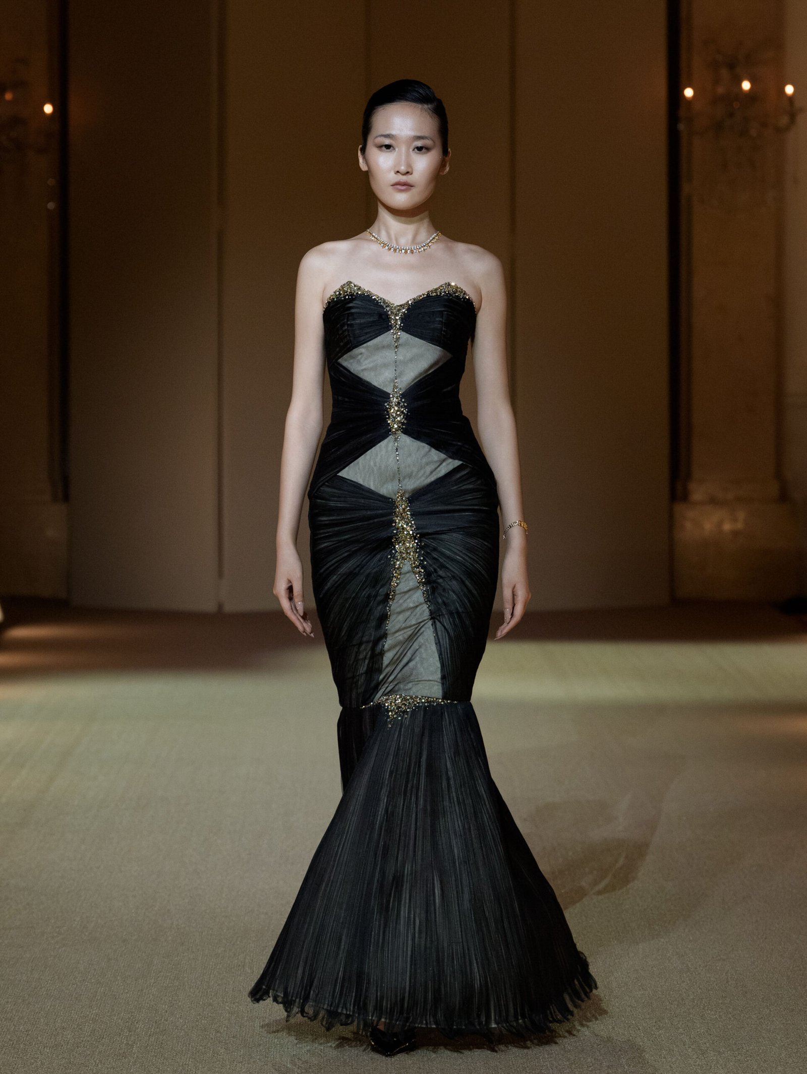 Black strapless mermaid gown with gold bead and rhinestone embellishment