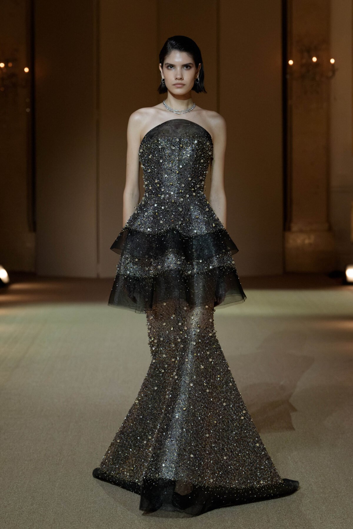 Black strapless fit-and-flare gown with dense beaded embellishment
