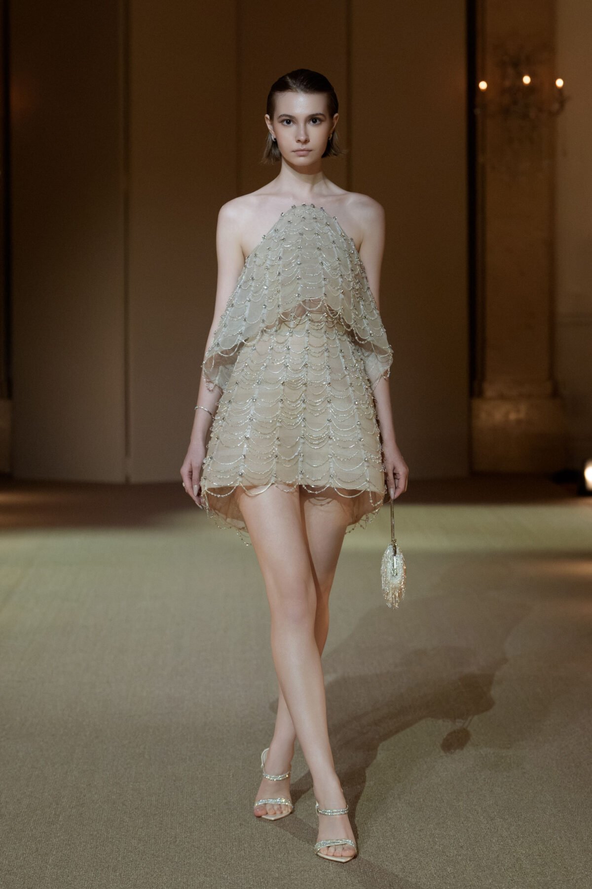 Soft champagne halterneck A-line cocktail dress with crystal chain embellishment