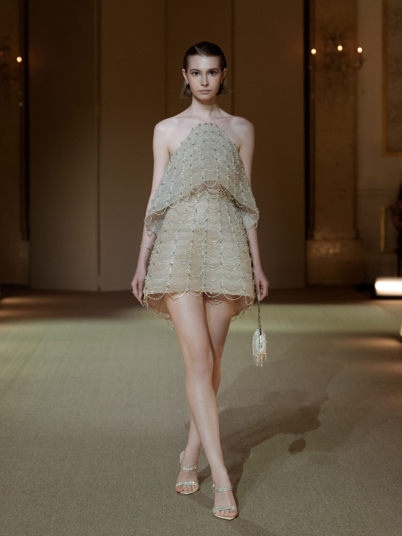 Soft champagne halterneck A-line cocktail dress with crystal chain embellishment