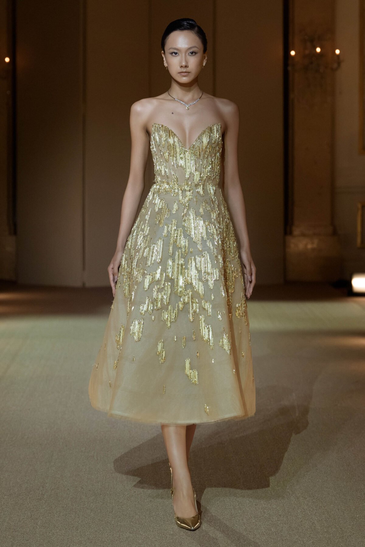 Gold A-line tea-length dress with crystal and chain embellishment