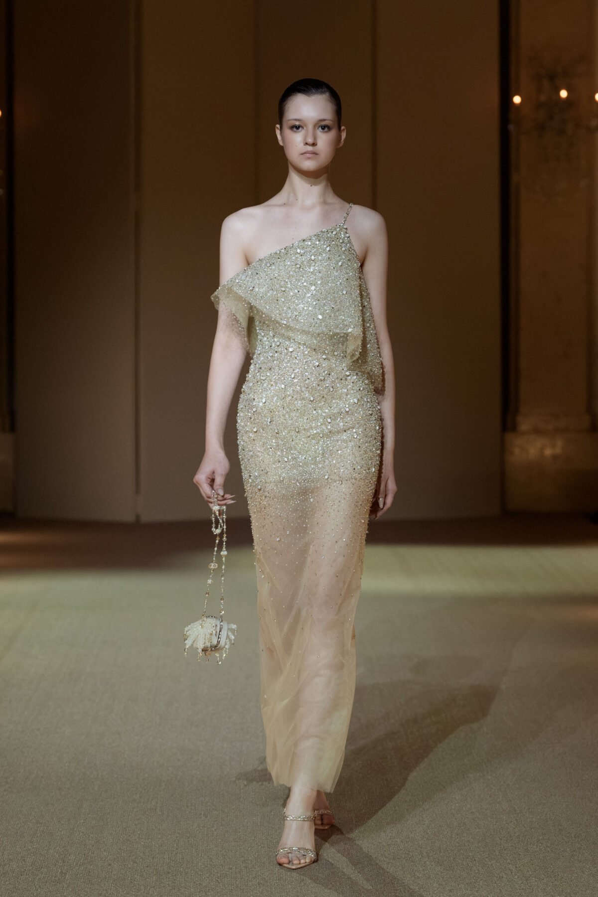 Champagne one-shoulder column dress with bead and rhinestone embellishment