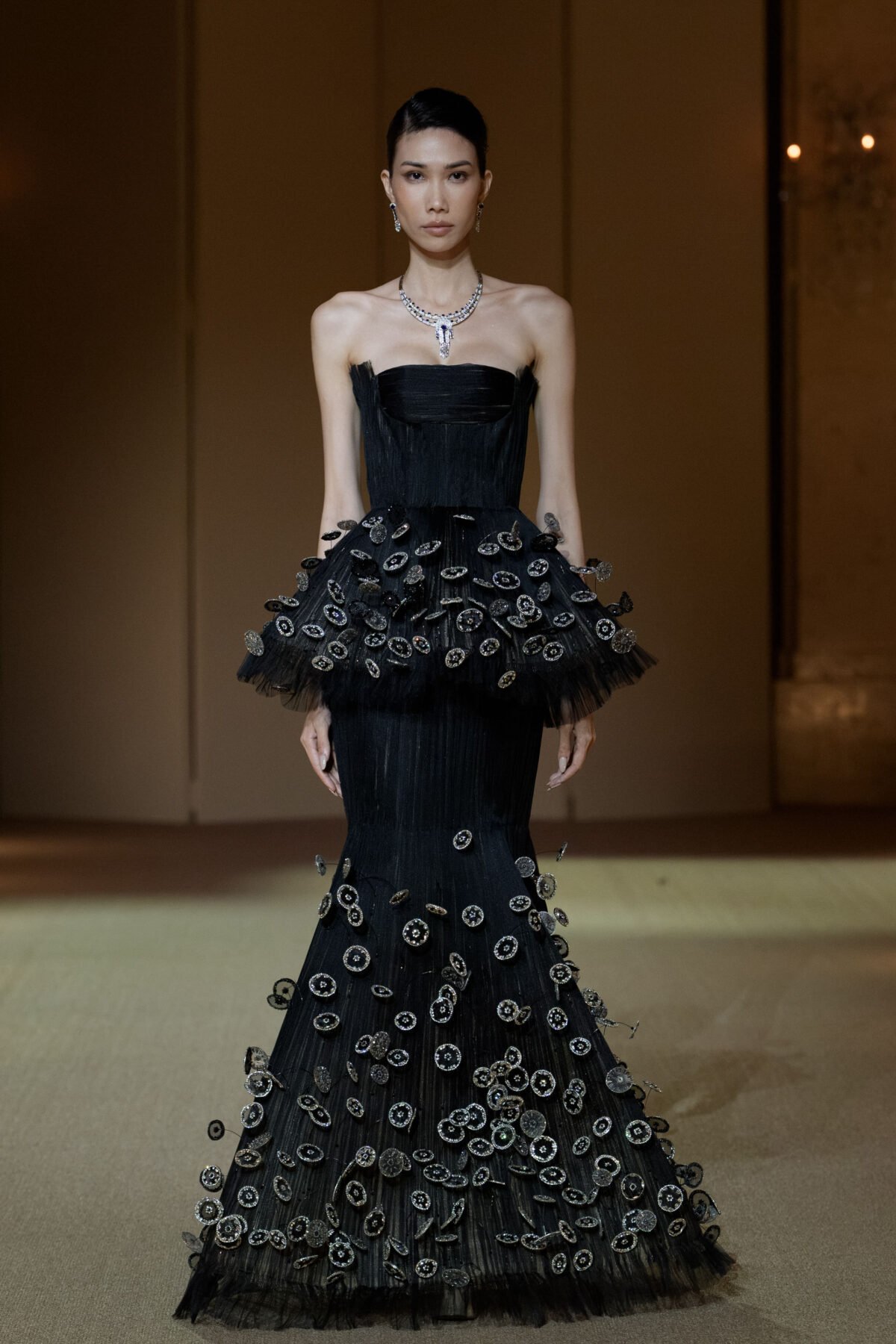 Black mermaid gown with 3D disc and crin appliqué embellishment