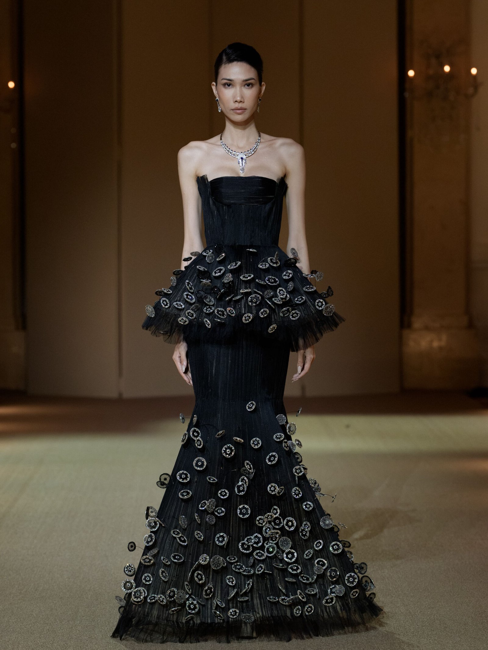 Black mermaid gown with 3D disc and crin appliqué embellishment